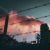 a factory with smoke coming out of it's stacks