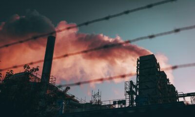 a factory with smoke coming out of it's stacks