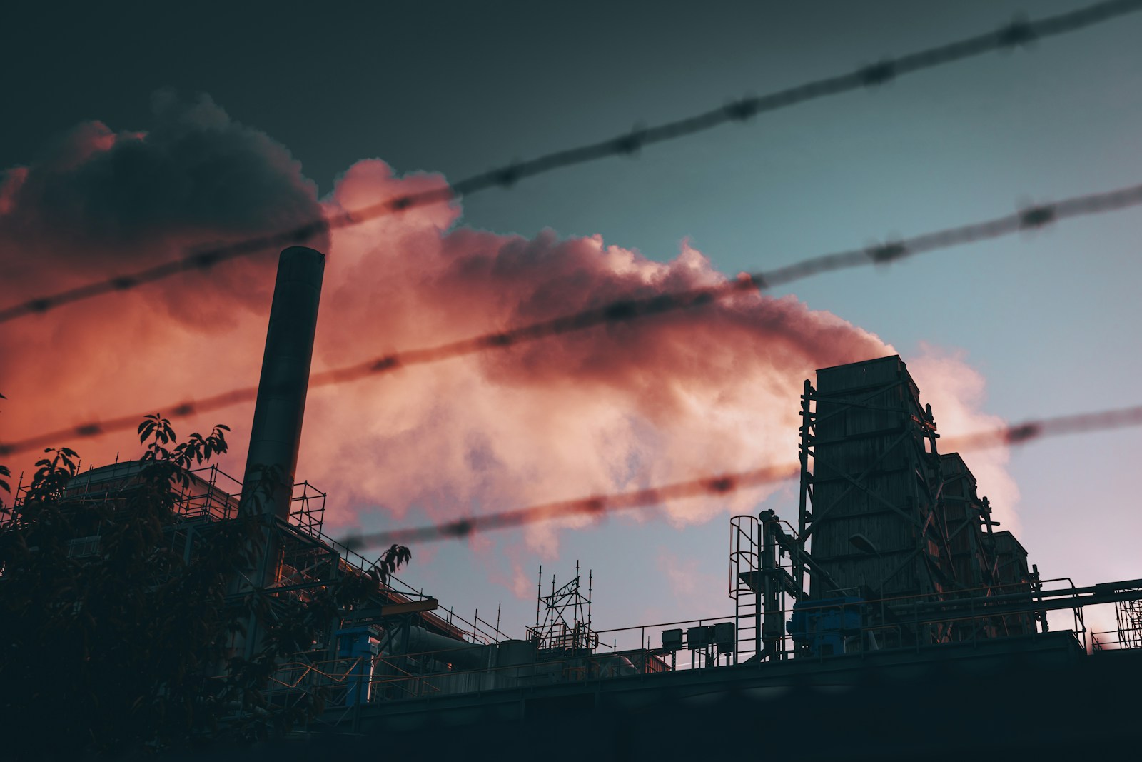 a factory with smoke coming out of it's stacks